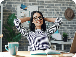 A team member laughing at her desk