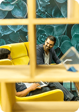 Team members relaxing in a lounge nook