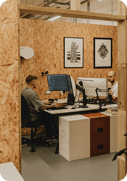 Two developers working at their desks